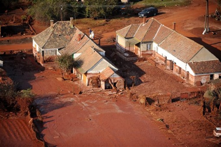 An aerial view of Kolontar village covered by toxic red mud, southwest of Budapest, Hungary, Tuesday after the dyke of a reservoir containing red mud of an alumina plant in nearby Ajka broke eight days earlier.